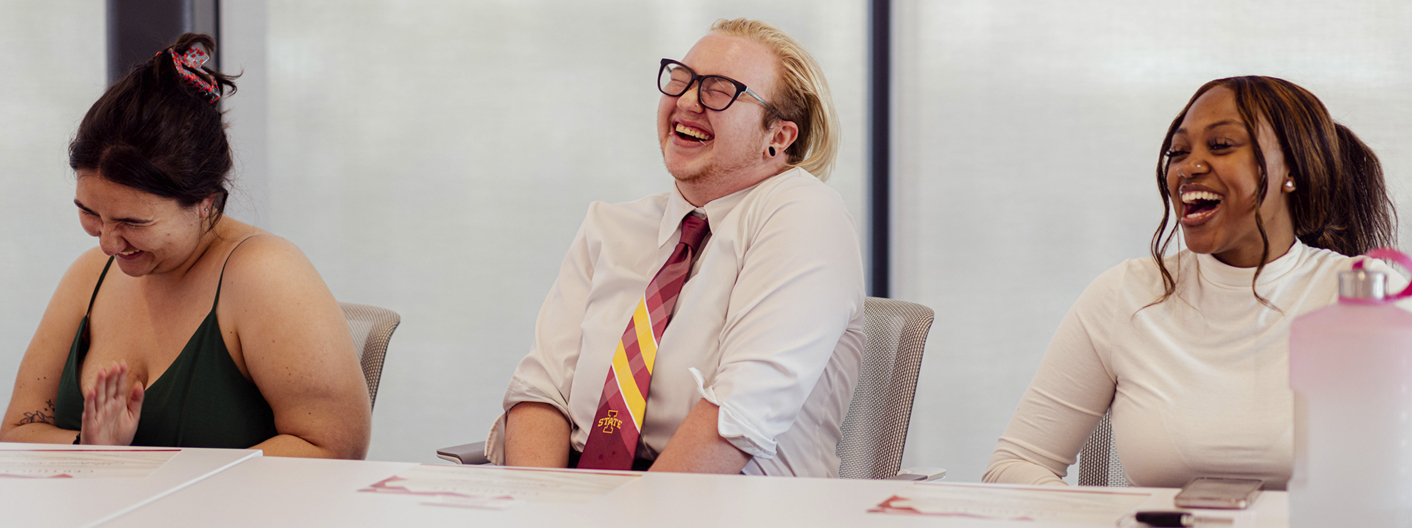 Group of students laughing at an Innovation event