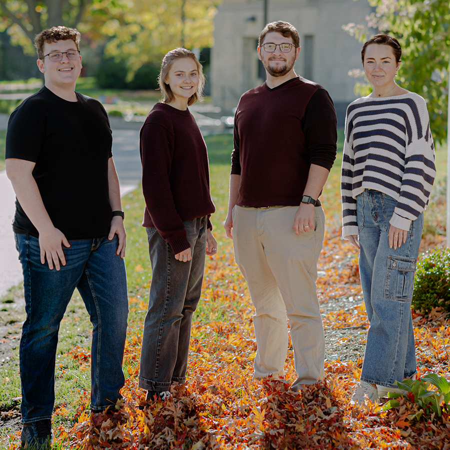 Group of students standing in front of Ross Hall in the Fall